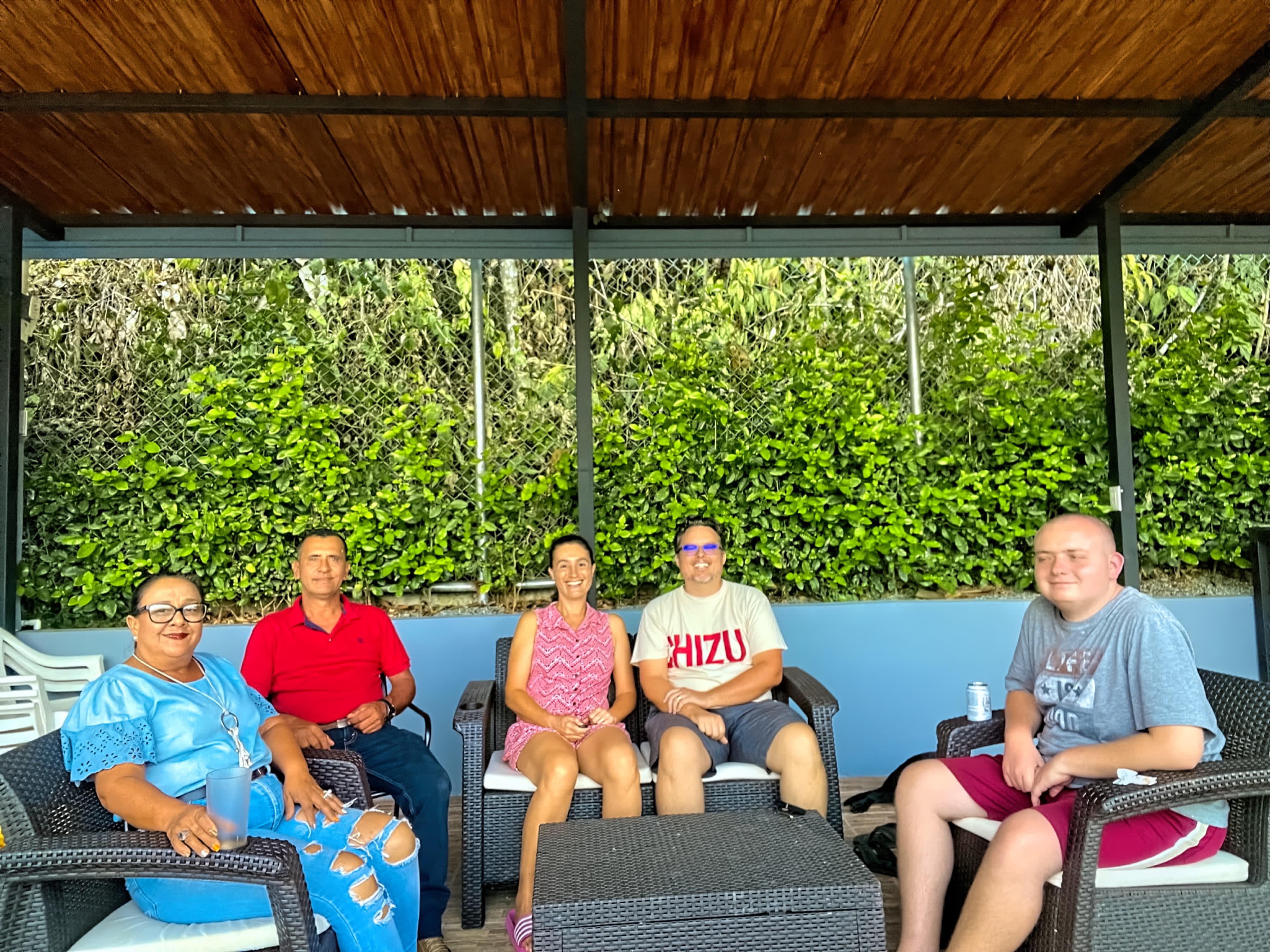 Nephew Rich, friends Nela and Berny sit with Maria and Neil while wearing their Chizu shirts in Quebradas, PZ, CR