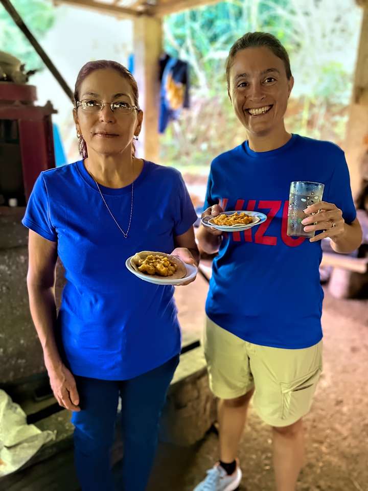 Friend Yeni shares lunch with Maria while wearing her Chizu shirt in El Roble, PZ, CR